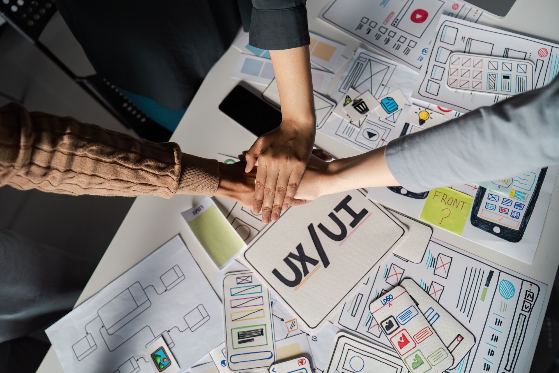 Collaborative UX/UI Design Brainstorming Session with Creative Teamwork and Innovative Ideas